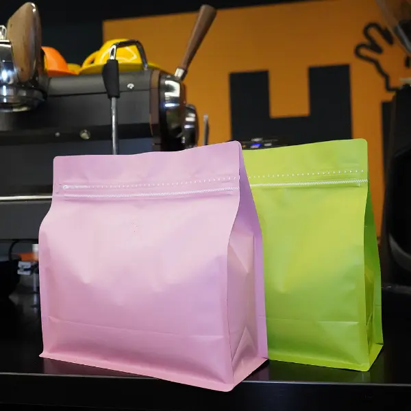 1Sacs à crosse horizontale en kg en couleurs rose et verte