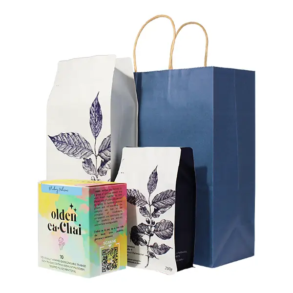 De grands sacs cadeaux en papier kraft contenant des sacs et des boîtes à café pour la vente au détail et les cadeaux