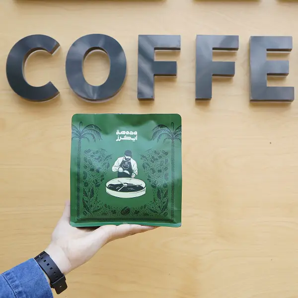 Boîte à café imprimée en vert avec emballage spécial filtre